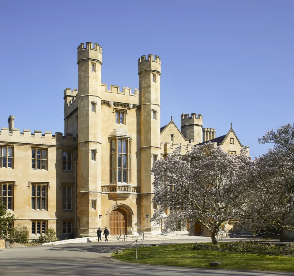 Lambeth palace exterior with magnolia tree to the right and blue skies.