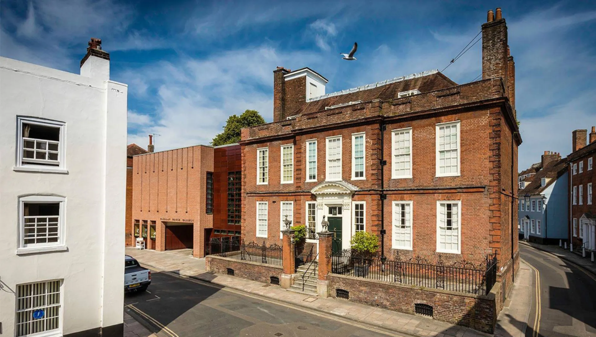 Exterior of Pallant House Gallery a brick building situated on the corner of a street in the UK