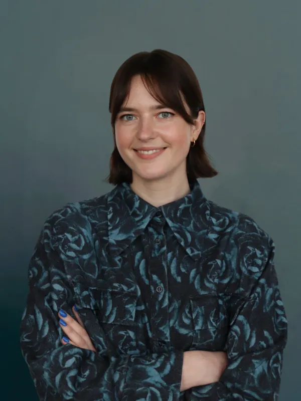 Portrait of a woman with a shirt with blue roses on it